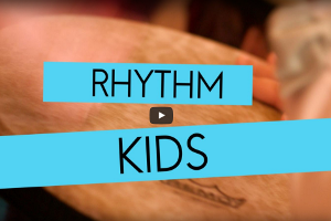 A video of a person playing drums with the words " rhythm kids ".